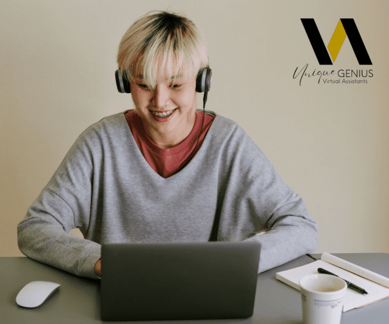 asian woman with headphones smiling while working on a laptop - unique genius