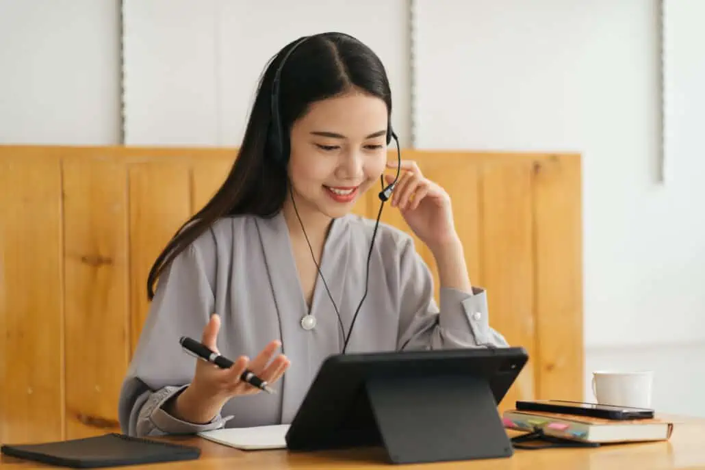 cheerful beautiful asian woman wearing headphones 2023 11 27 04 58 16 utc 1030x687 1