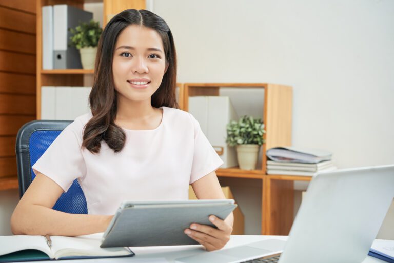 confident modern woman with tablet office